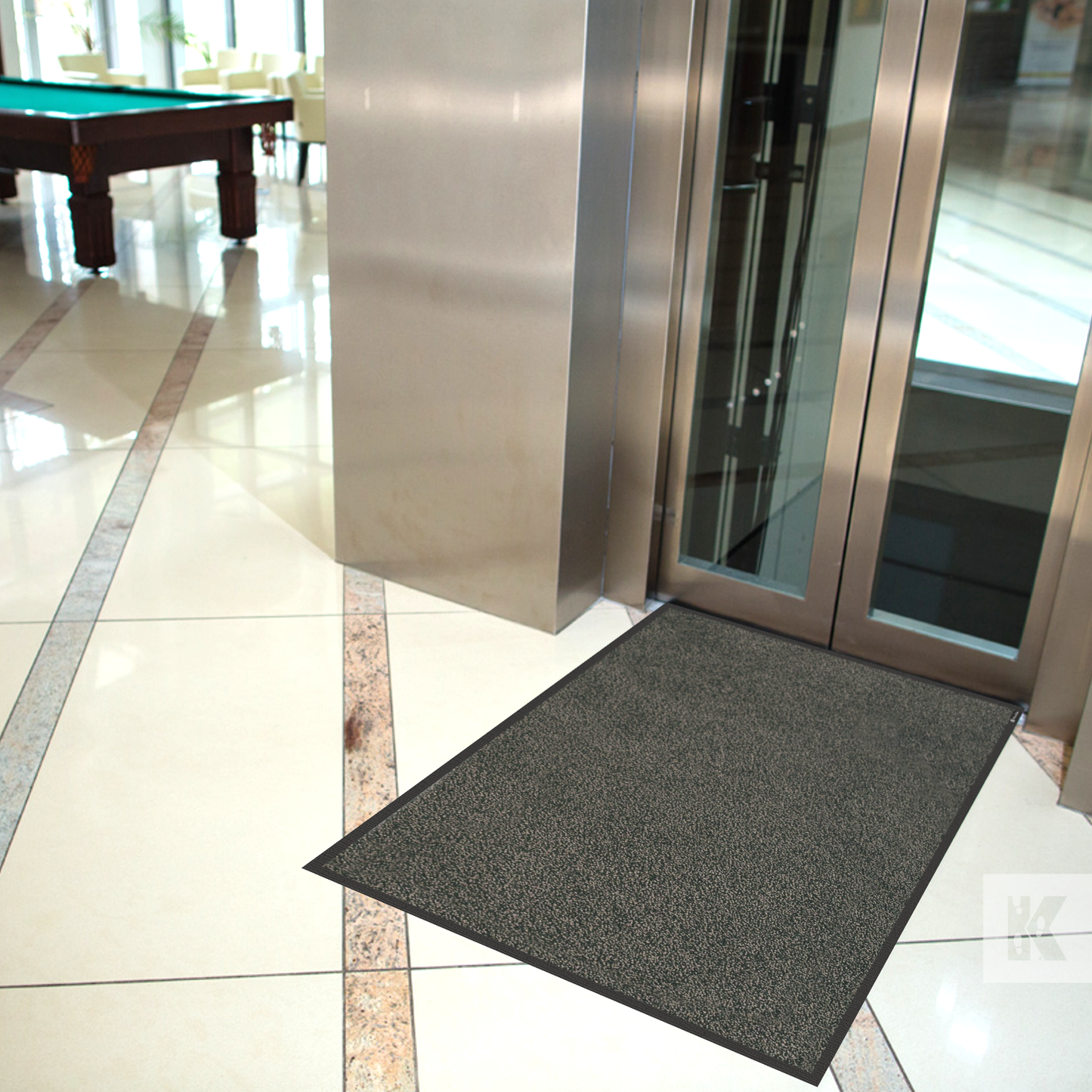 Iron-Horse - Mink coloured Iron-Horse mat in front of a chrome finished elevator door