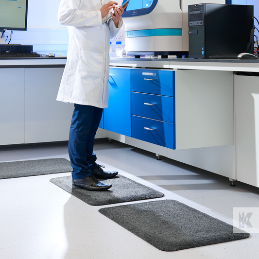 Kleen-Comfort Soft - A scientist works in a clen laboratory, stood on a fabric coated anti-fatigue mat