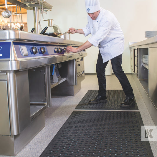 Kleen-Thru Plus - Chef in a busy professional kitchen, standing on a rubber kitchen mat