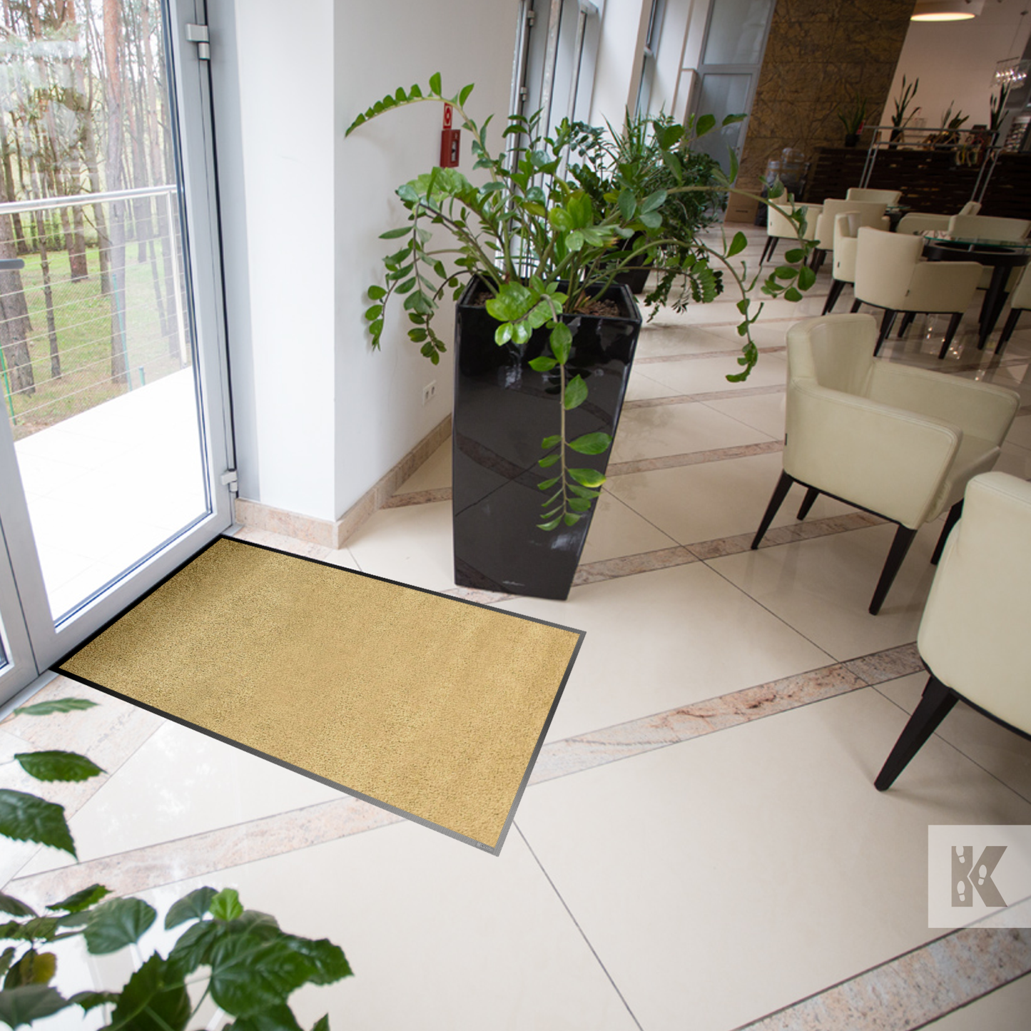 Iron-Horse Mono - Sand coloured mat on a tiled floor in a commercial dining setting