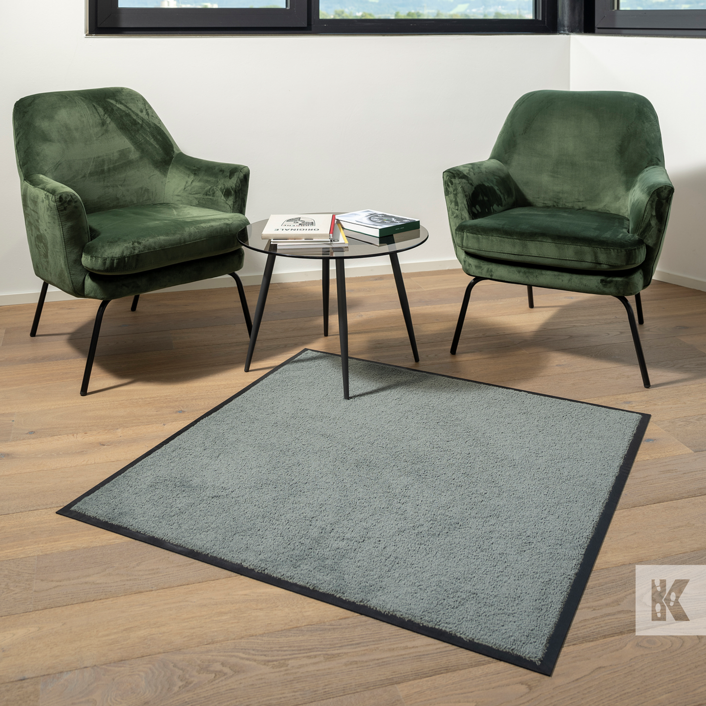 Iron-Horse Mono - Grey mat with two green chairs on a wooden floor