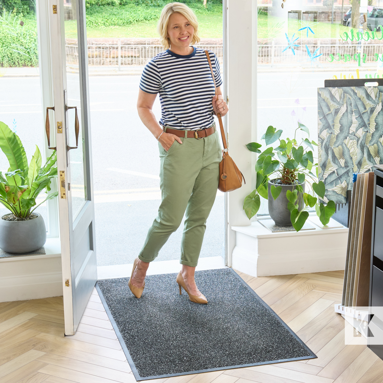 Super-Mat - Lady walking into a shop across a grey mat