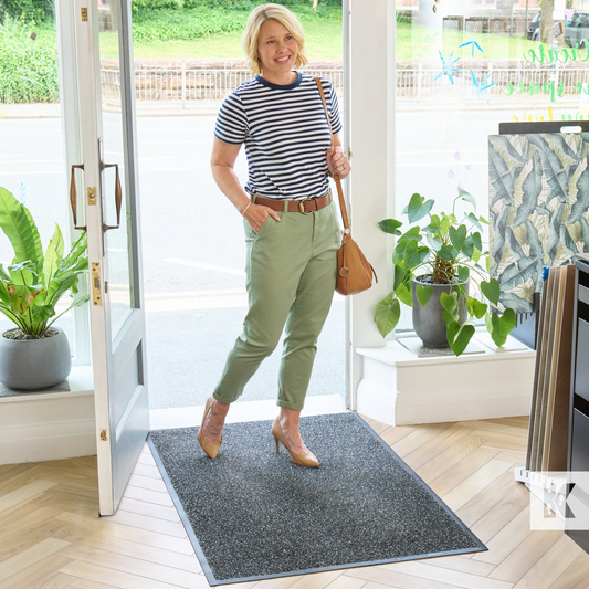 Super-Mat - Lady walking into a shop across a grey mat